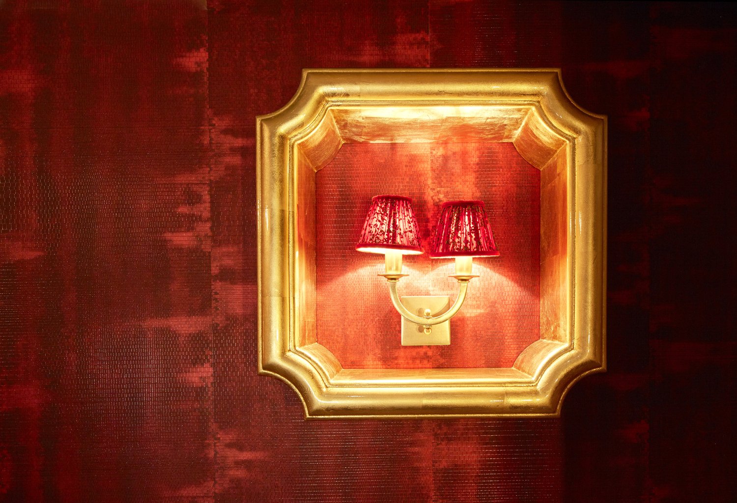 Gilt sconce detail in the living room